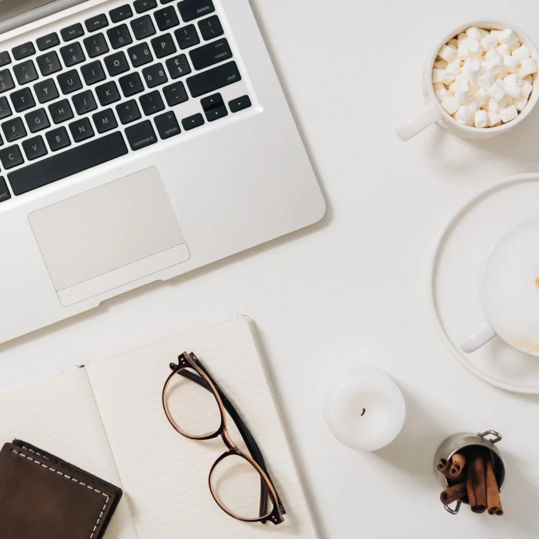 laptop and glasses on a desk