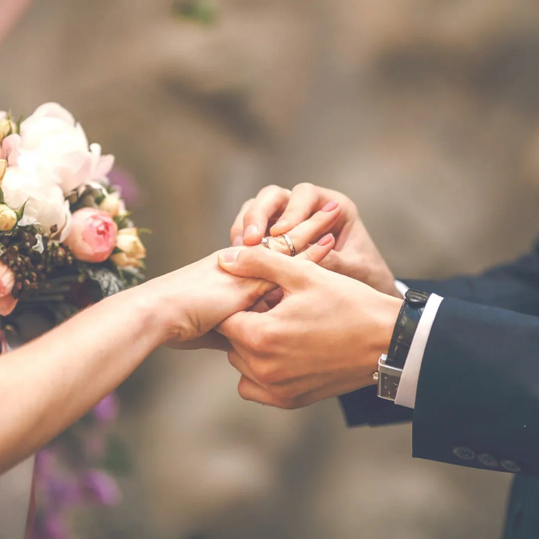 close up of hands with wedding ring
