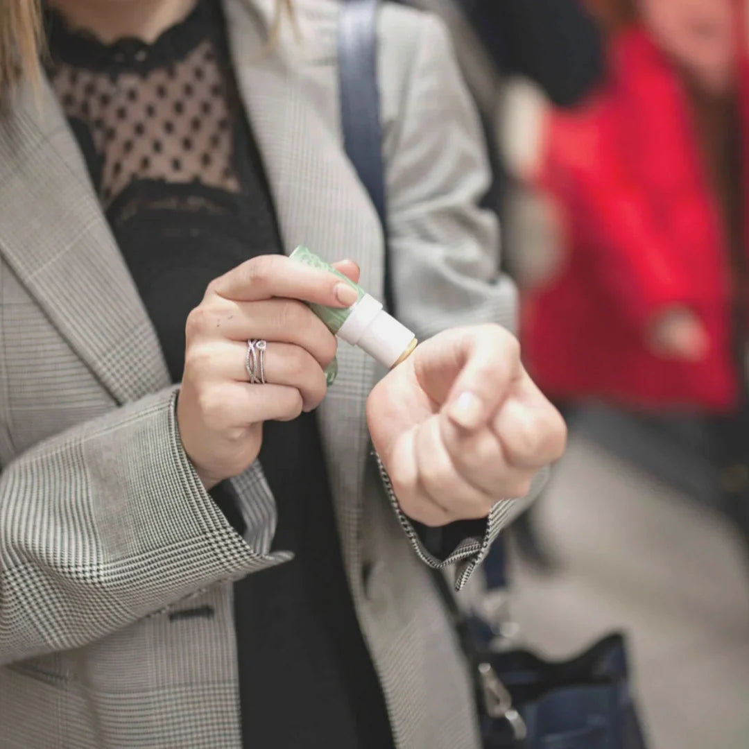 woman applying balm on her wrist