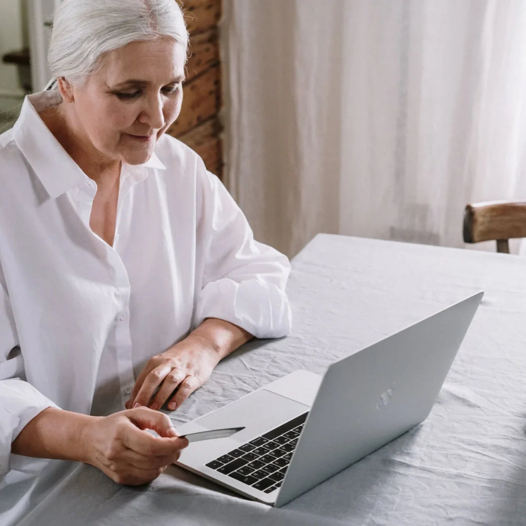 older woman in front of the laptop
