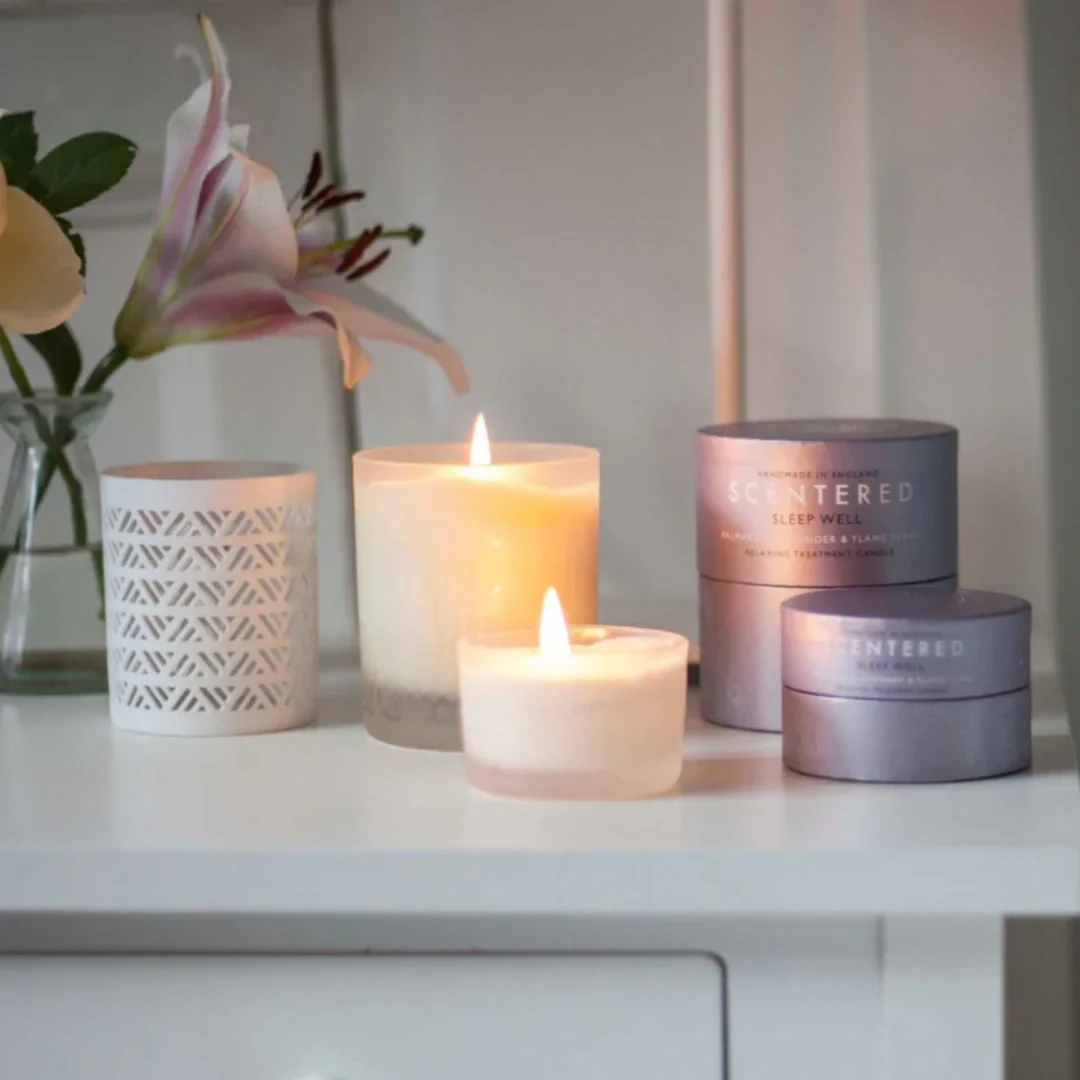 scentered candles on night table