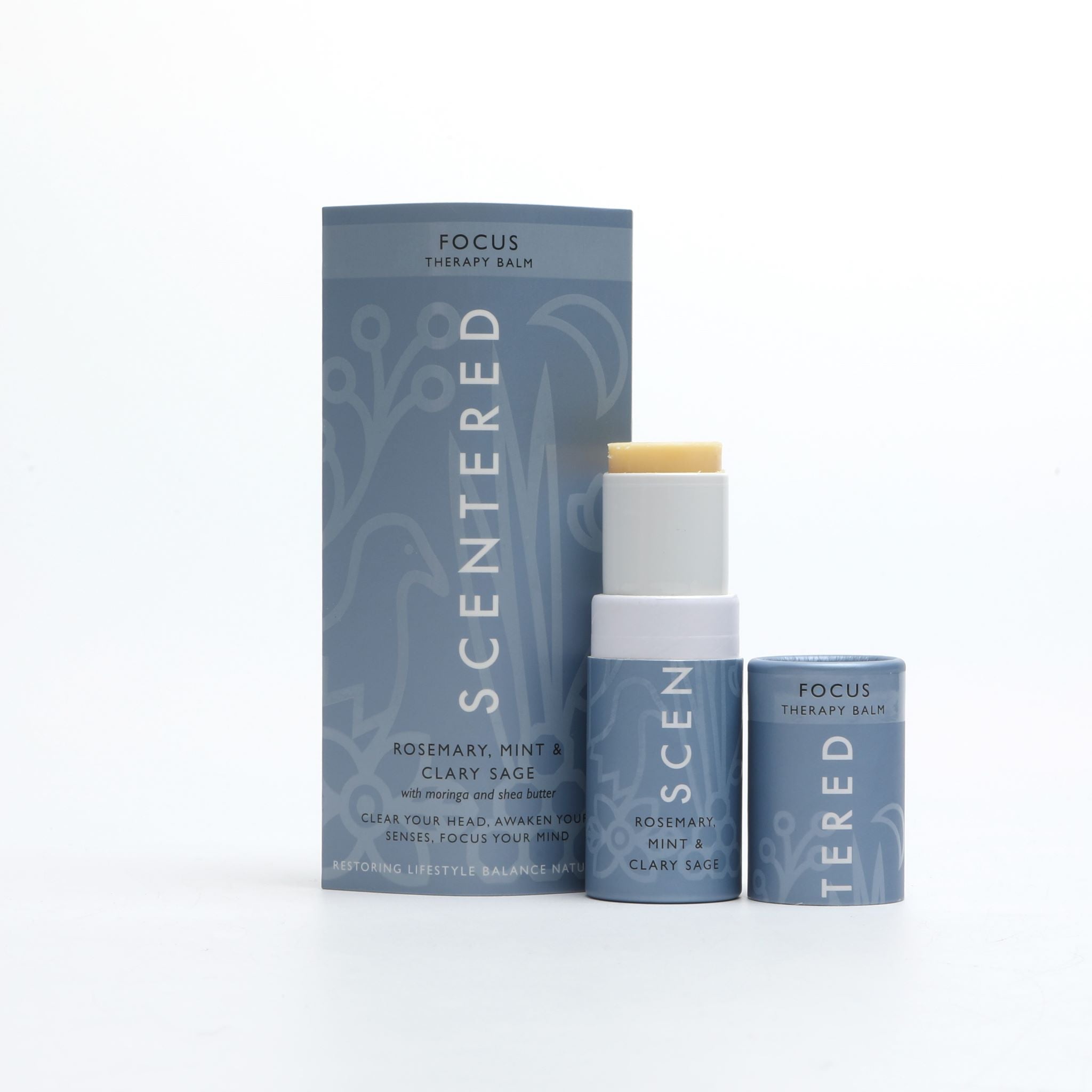 Focus Aromatherapy Balm with cap off and twisted up with eco sleeve packaging on a white background