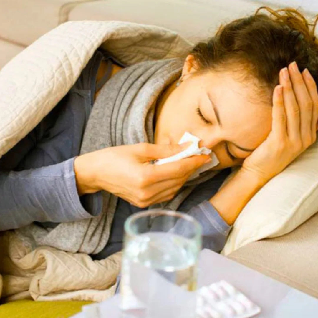 woman with a cold blowing her nose
