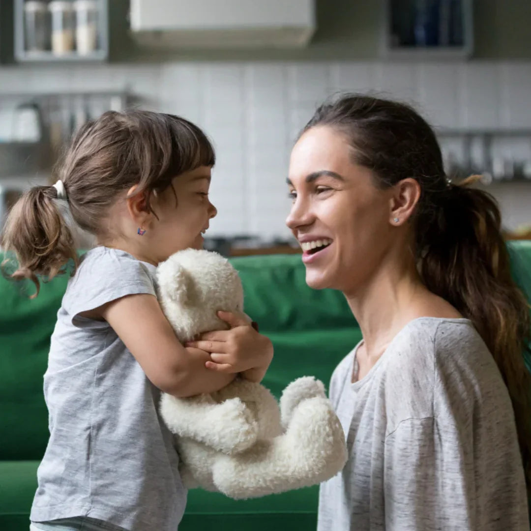 Mom smiling at her toddler