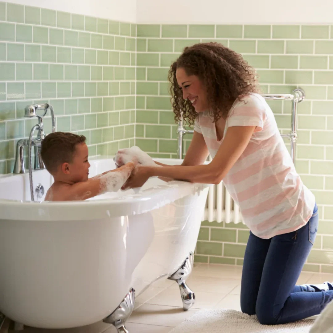 mom and toddler in bath time