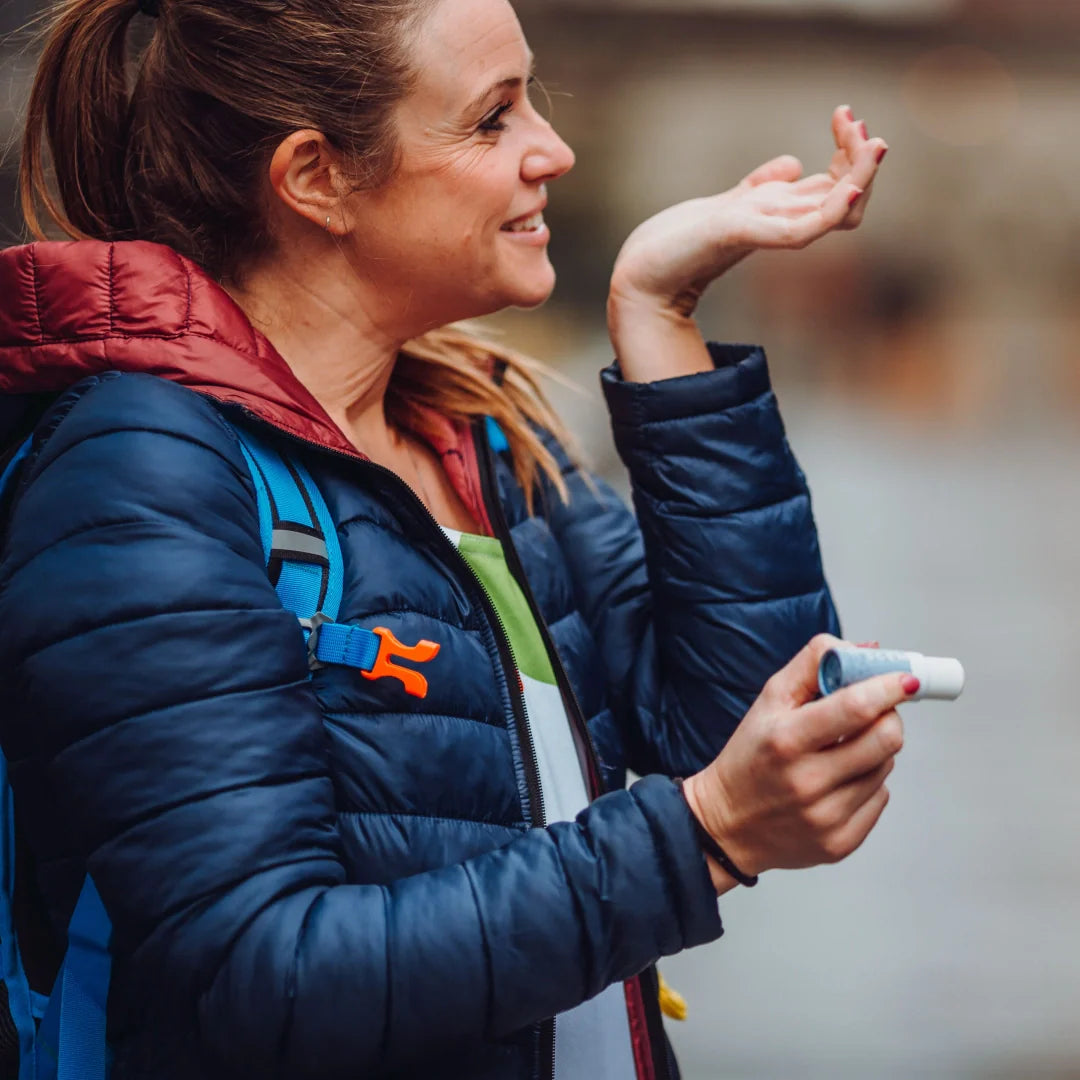 woman smelling where wrist 