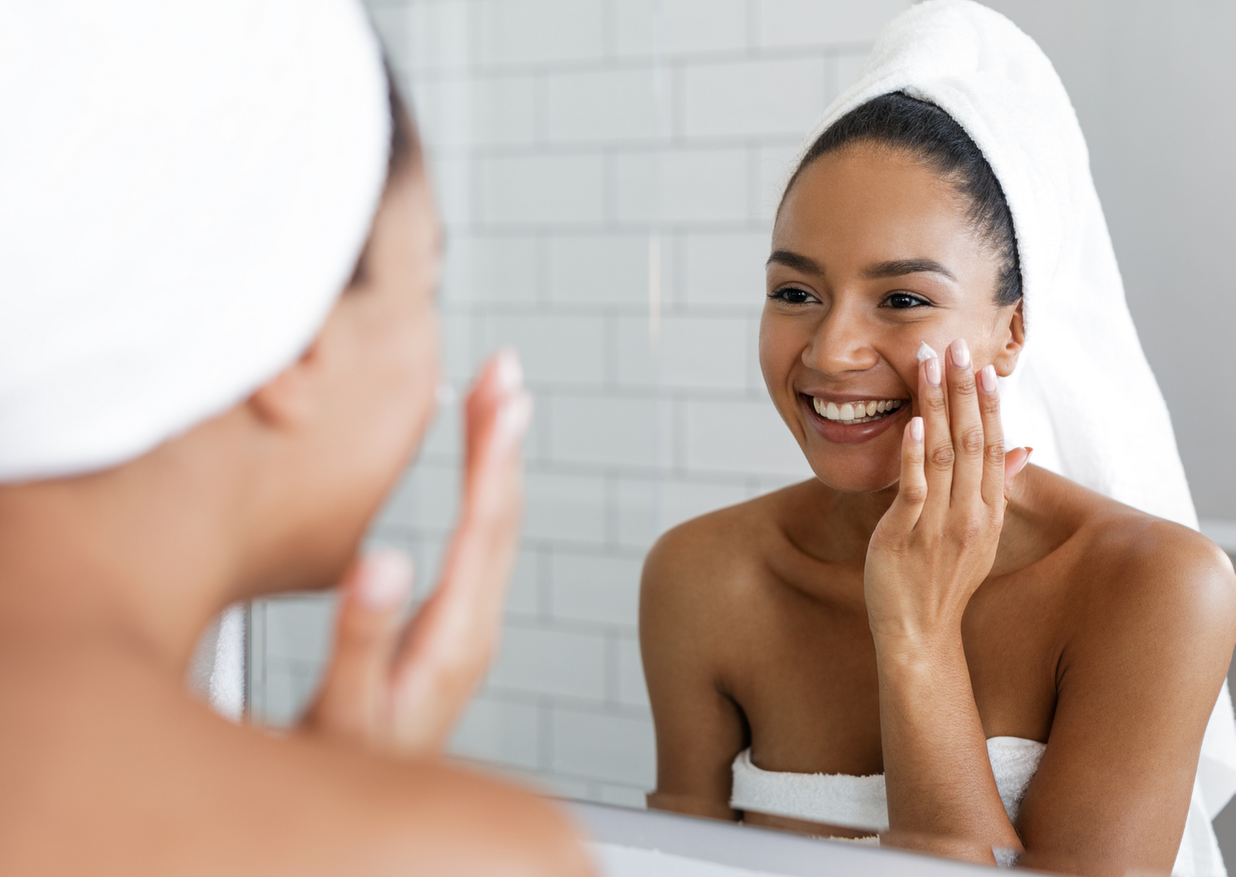 woman looking at herself in the mirror