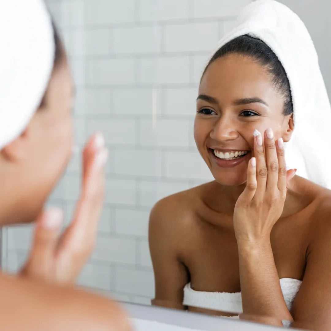 woman looking at herself in the mirror