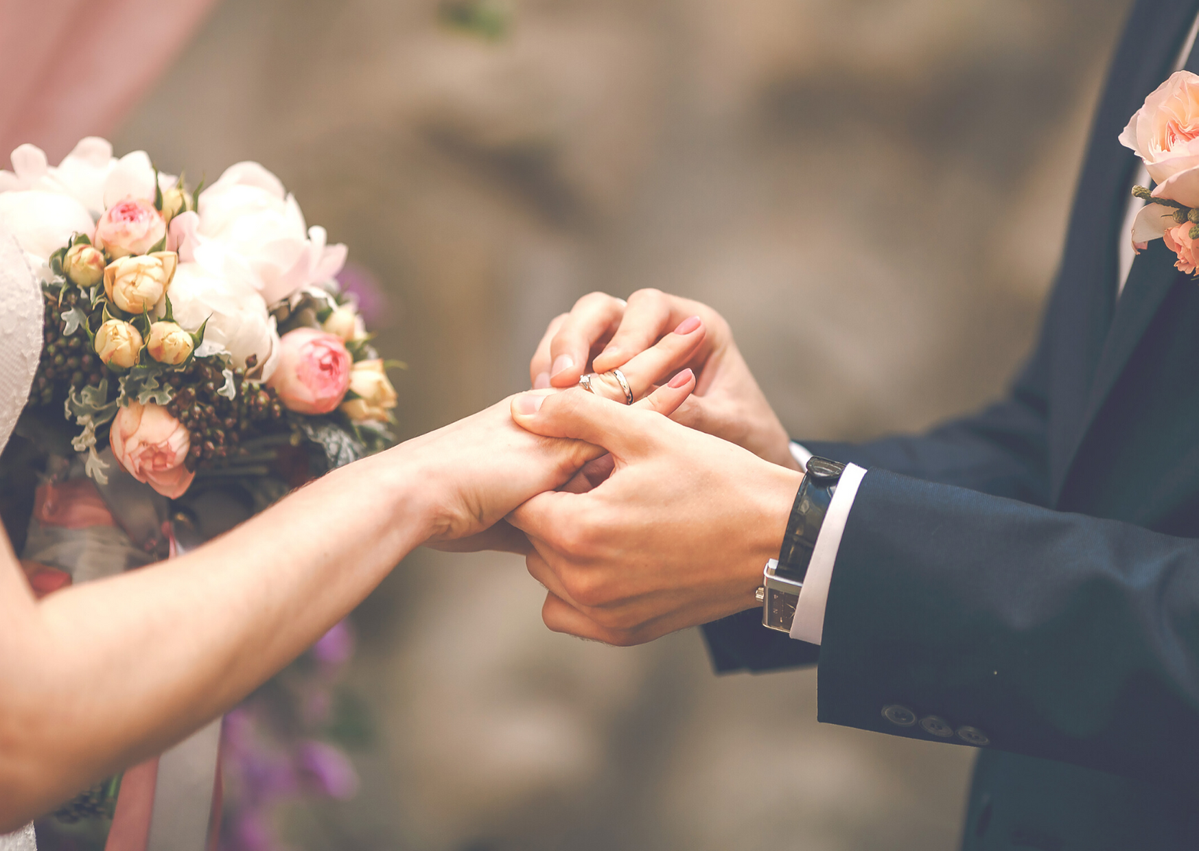 close up of hands with wedding ring