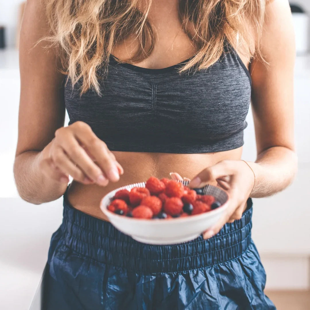woman eating berries