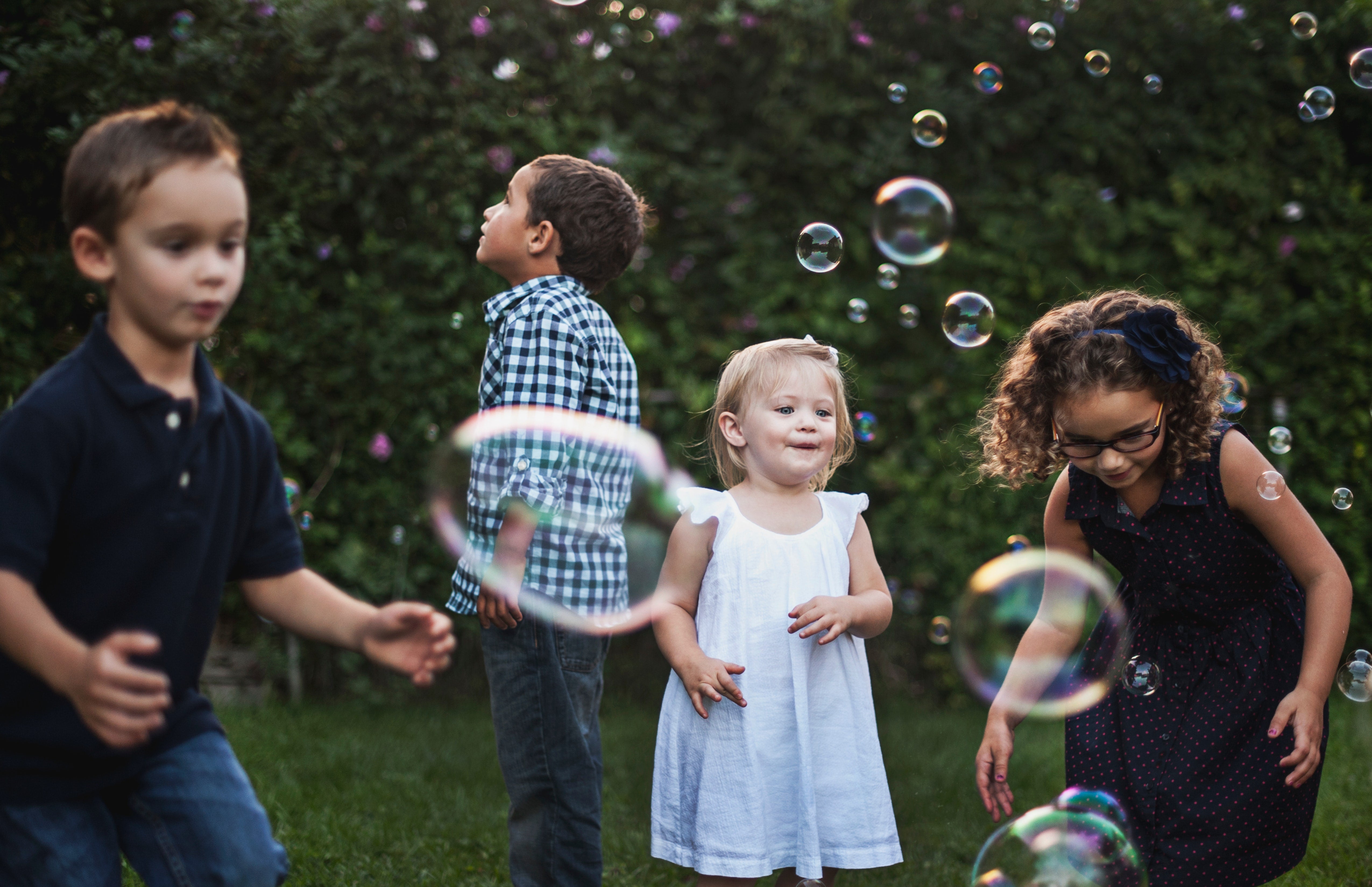 children playing with bubbles