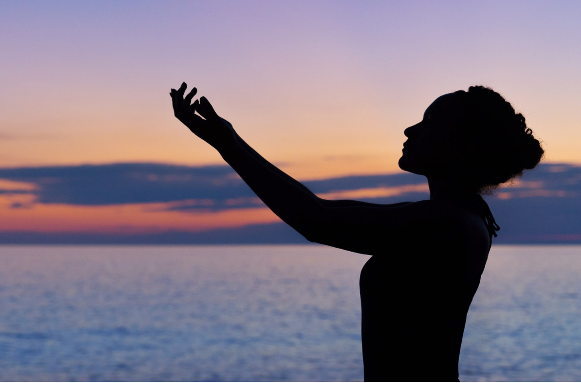 woman stretching on the beach