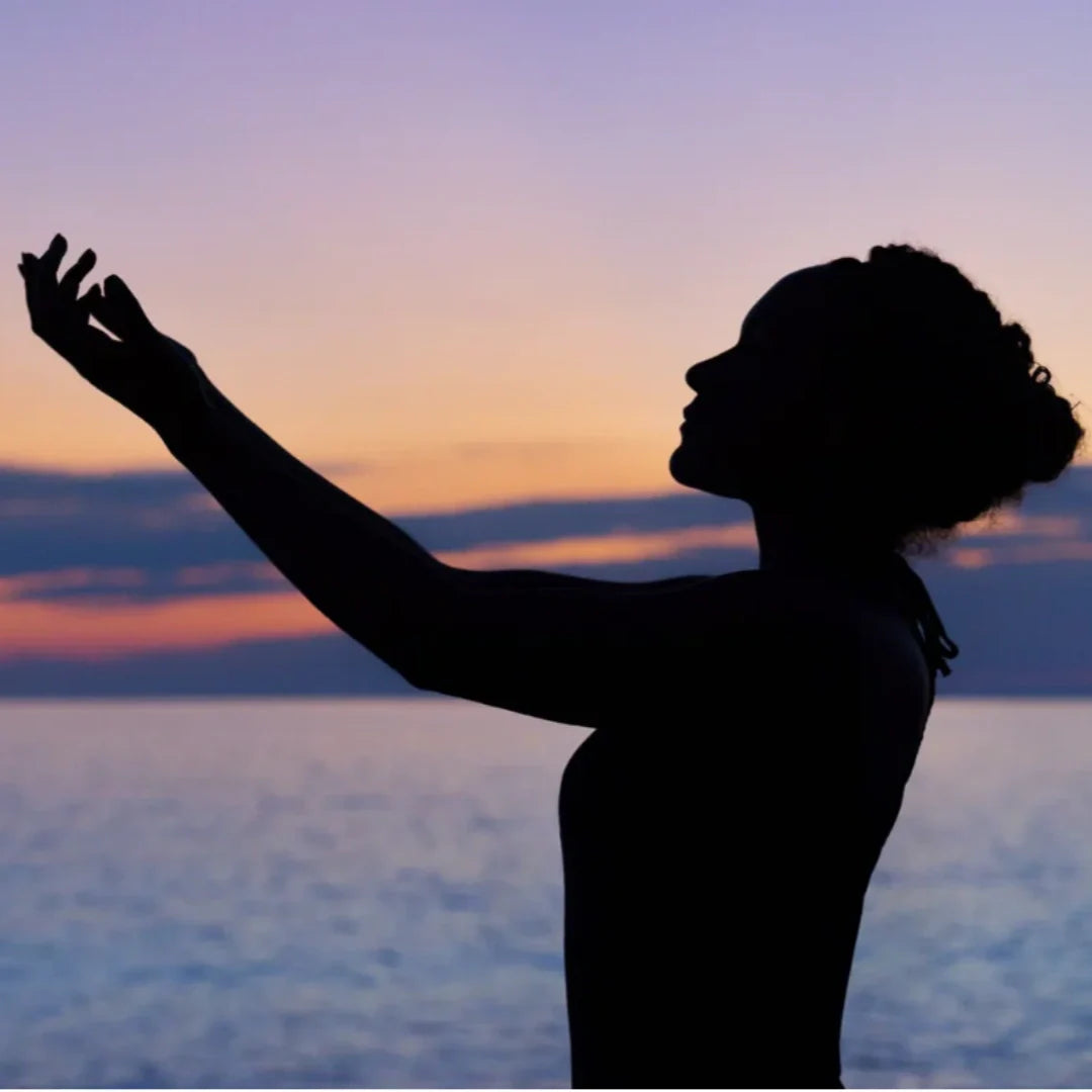 woman stretching on the beach