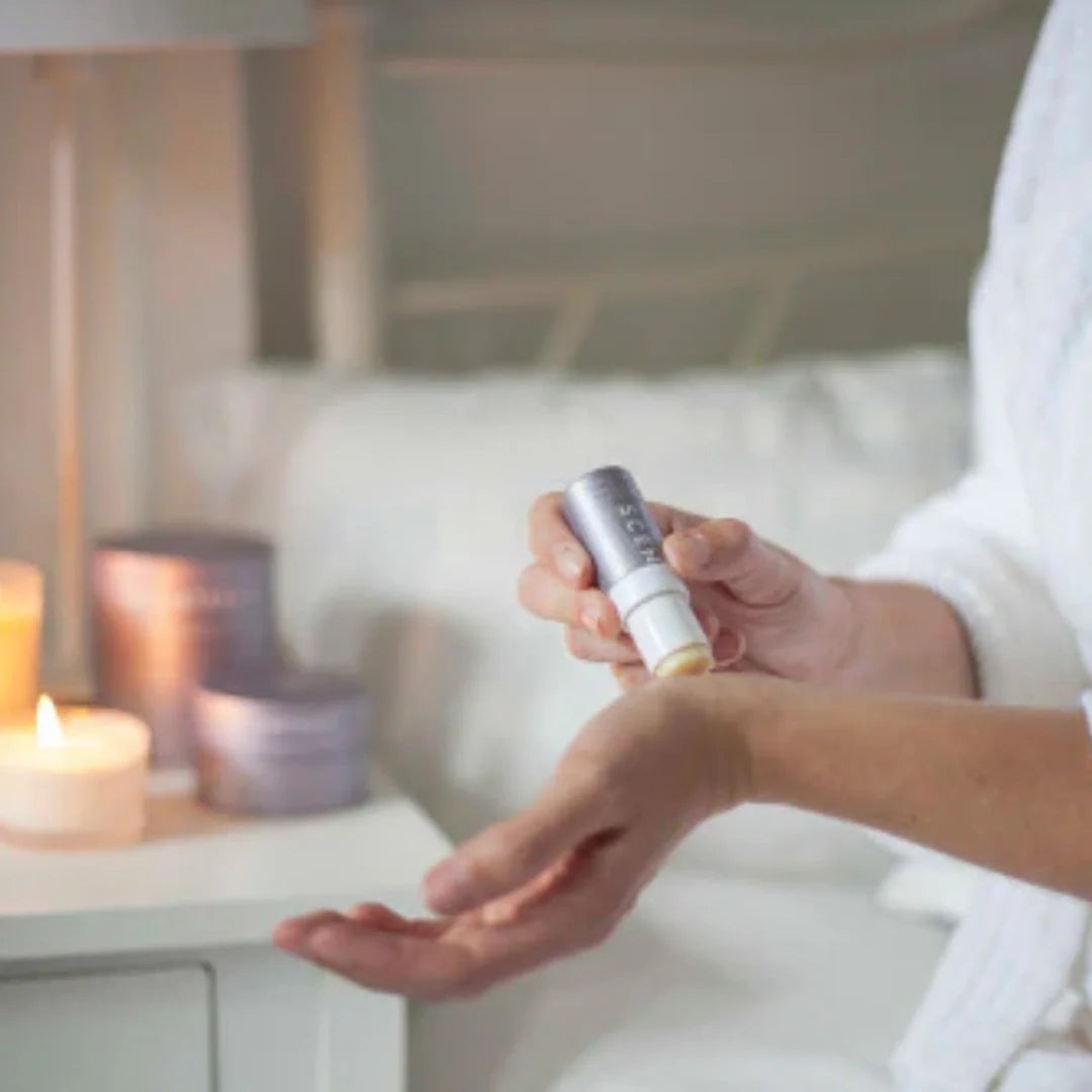 woman applying aromatherapy balm