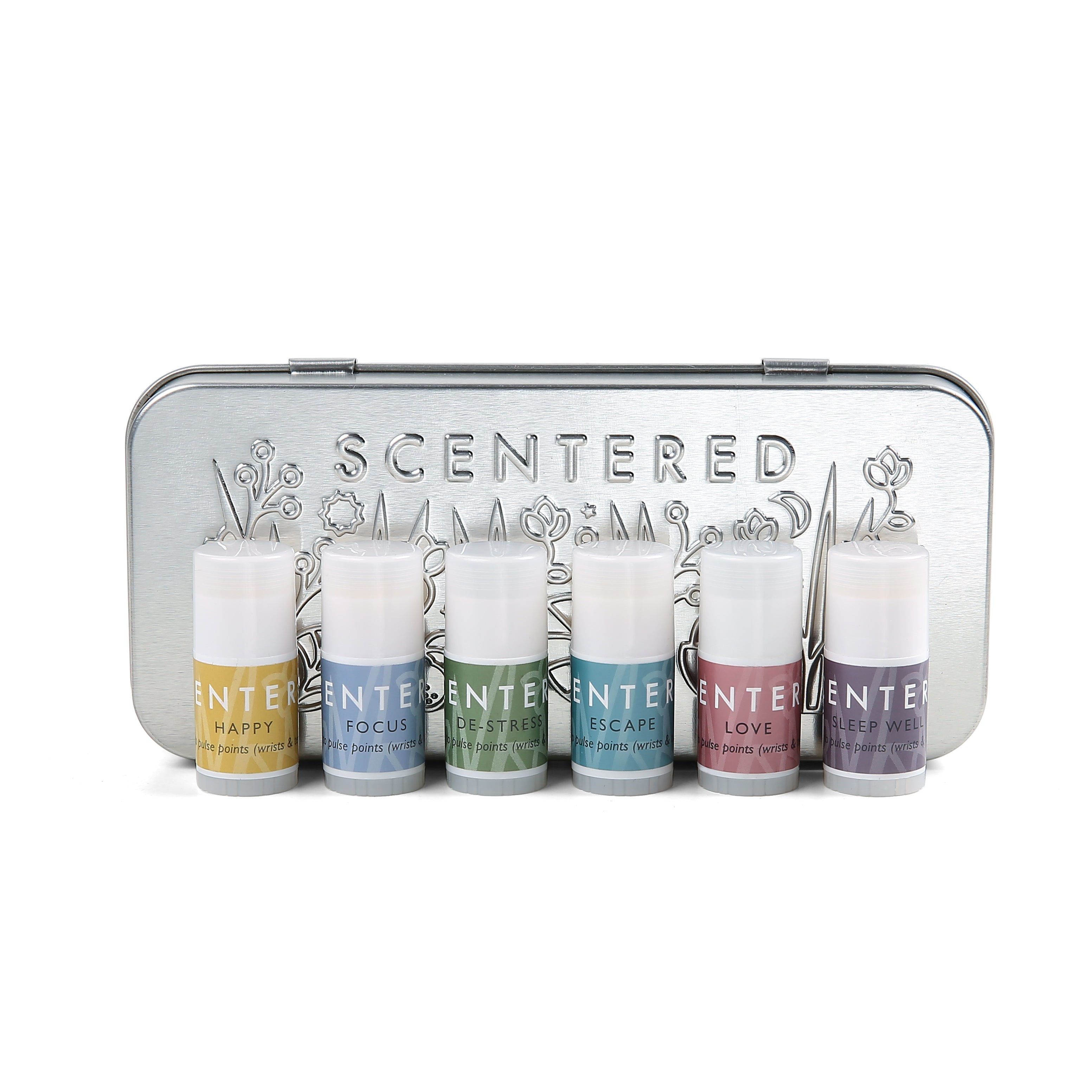 Set of six mini balms with different smell in front of the tin.