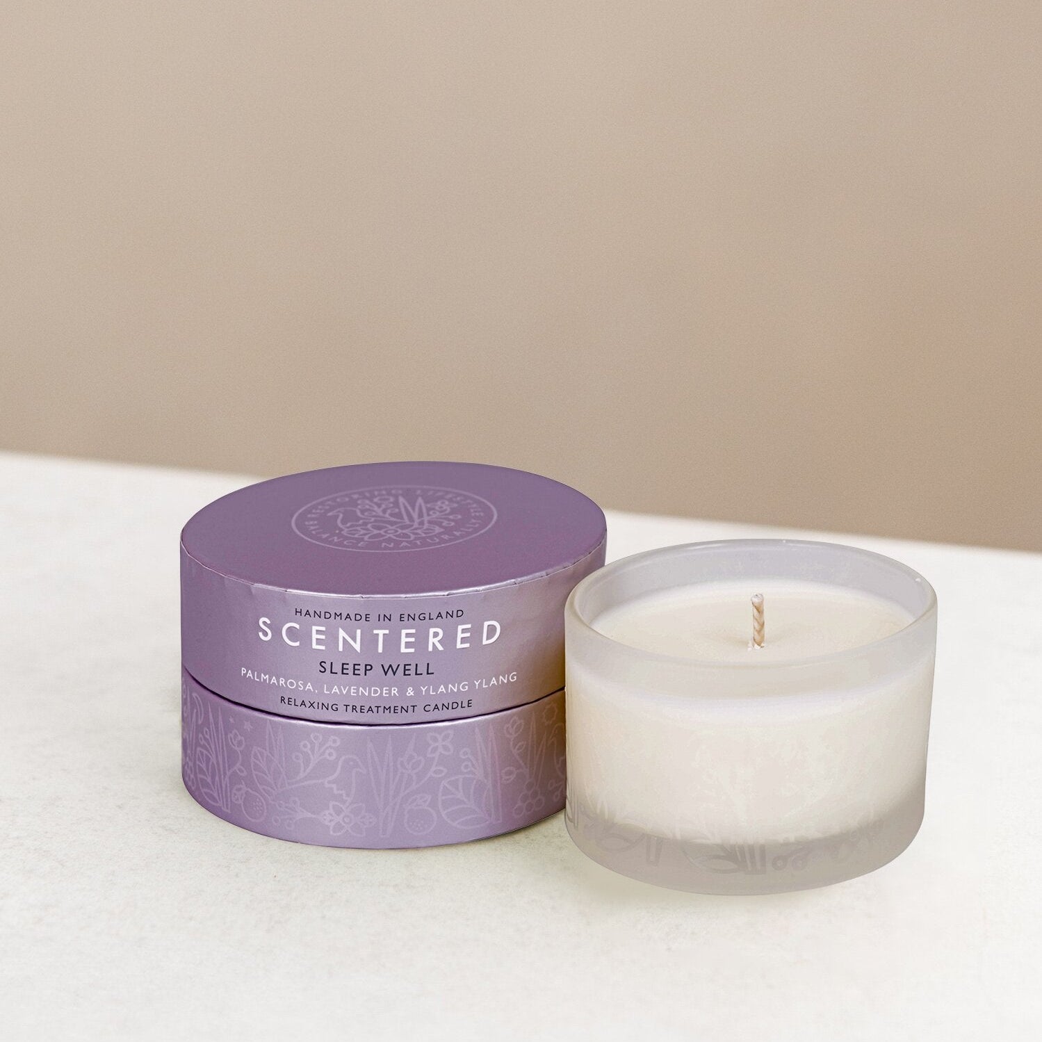Scented sleep well candle and packaging on display.
