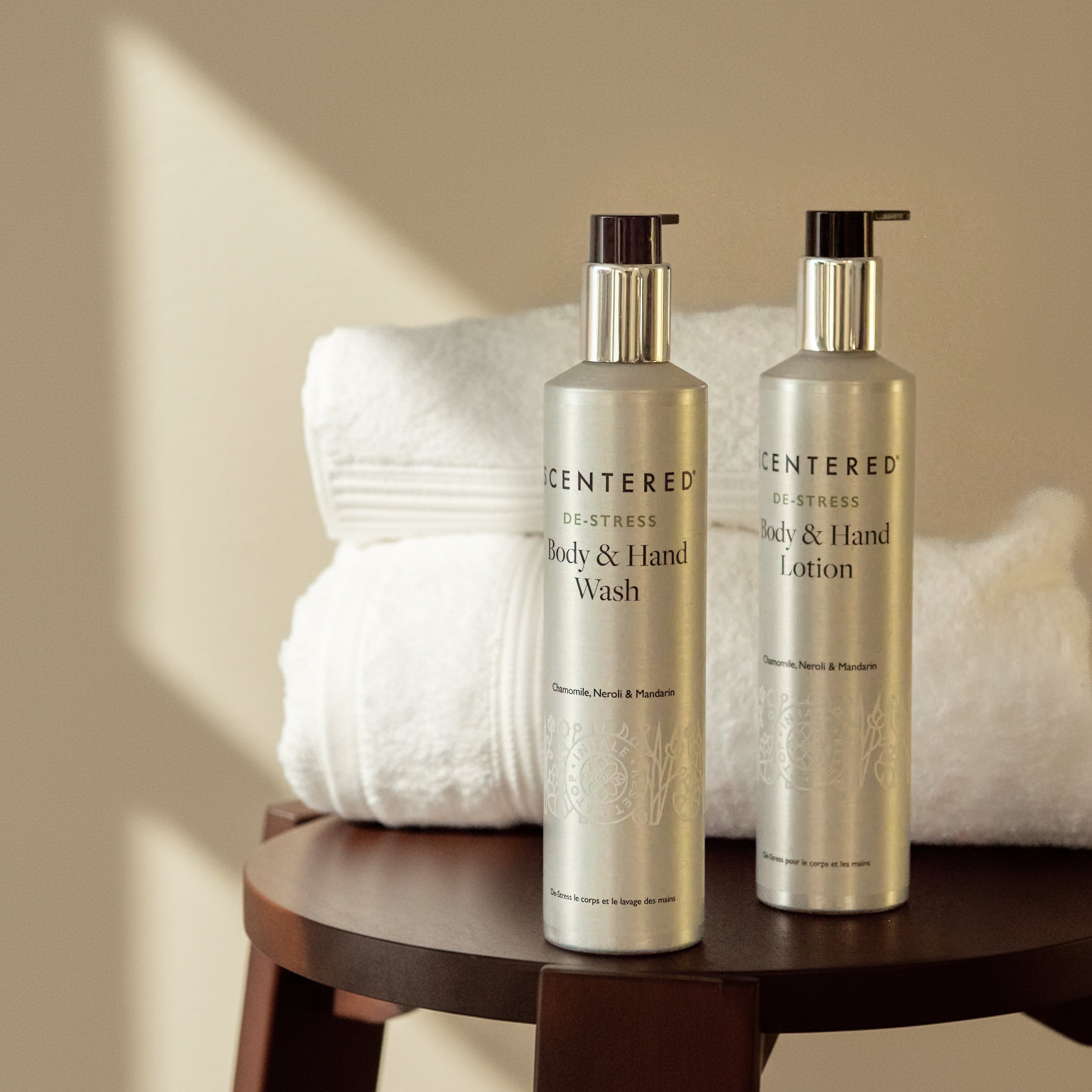 Body and hand wash lotion on the chair with the towel.