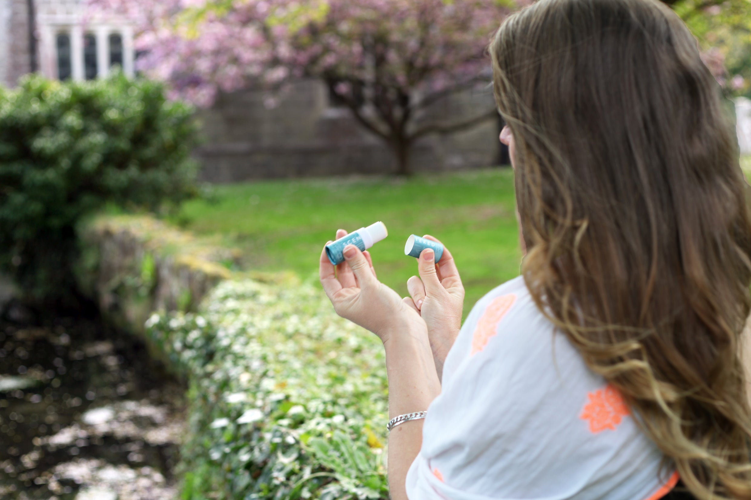 Garden_image_of_lady_applying_Escape_balm