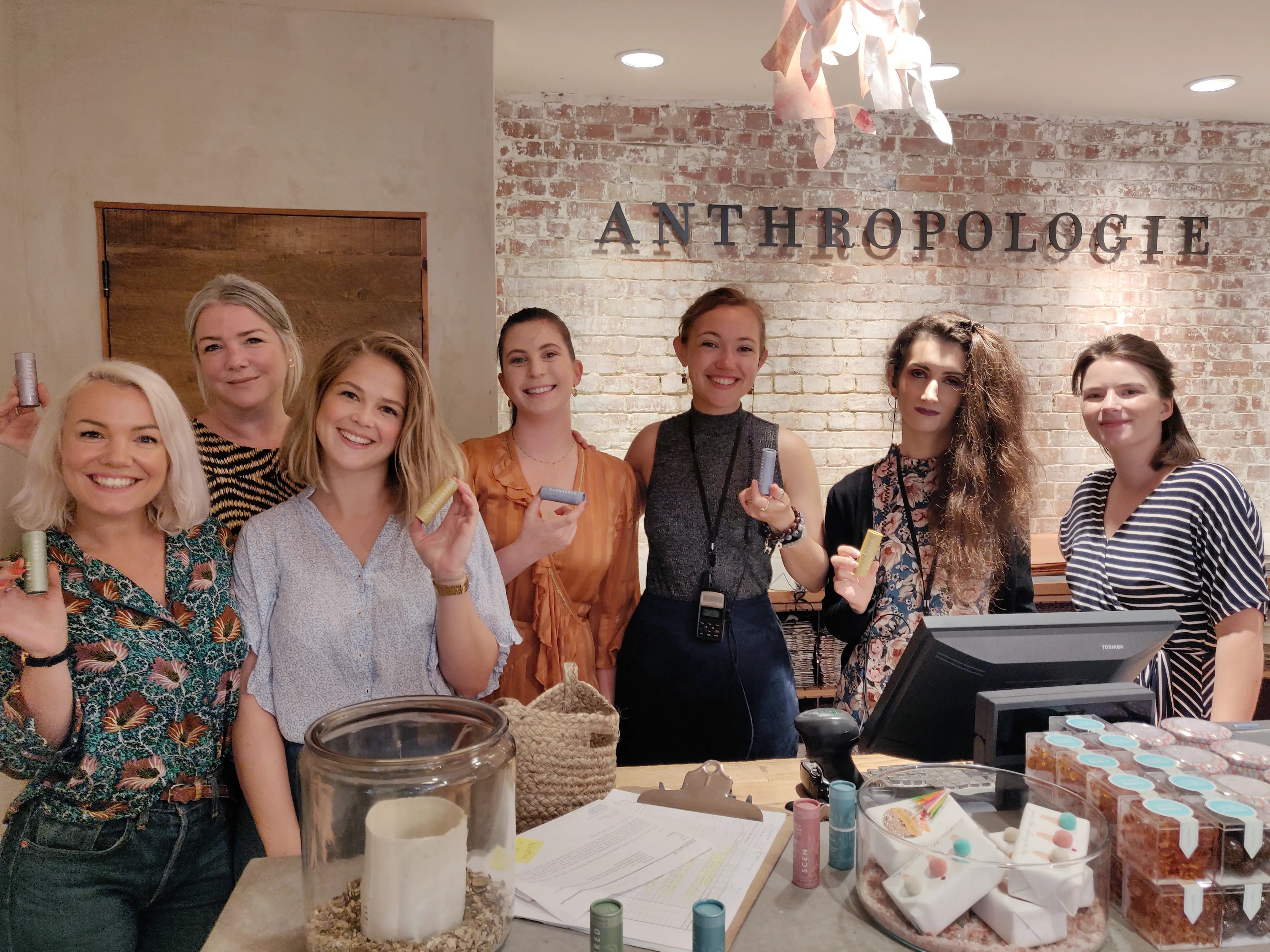 Anthropologie staff holding Scentered balms