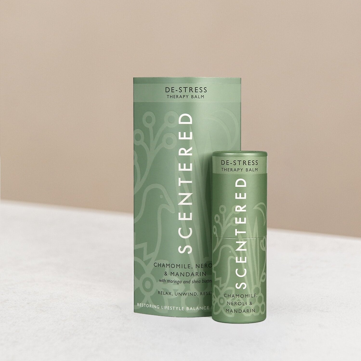 Scentered de-stress therapy balm and packaging on display.