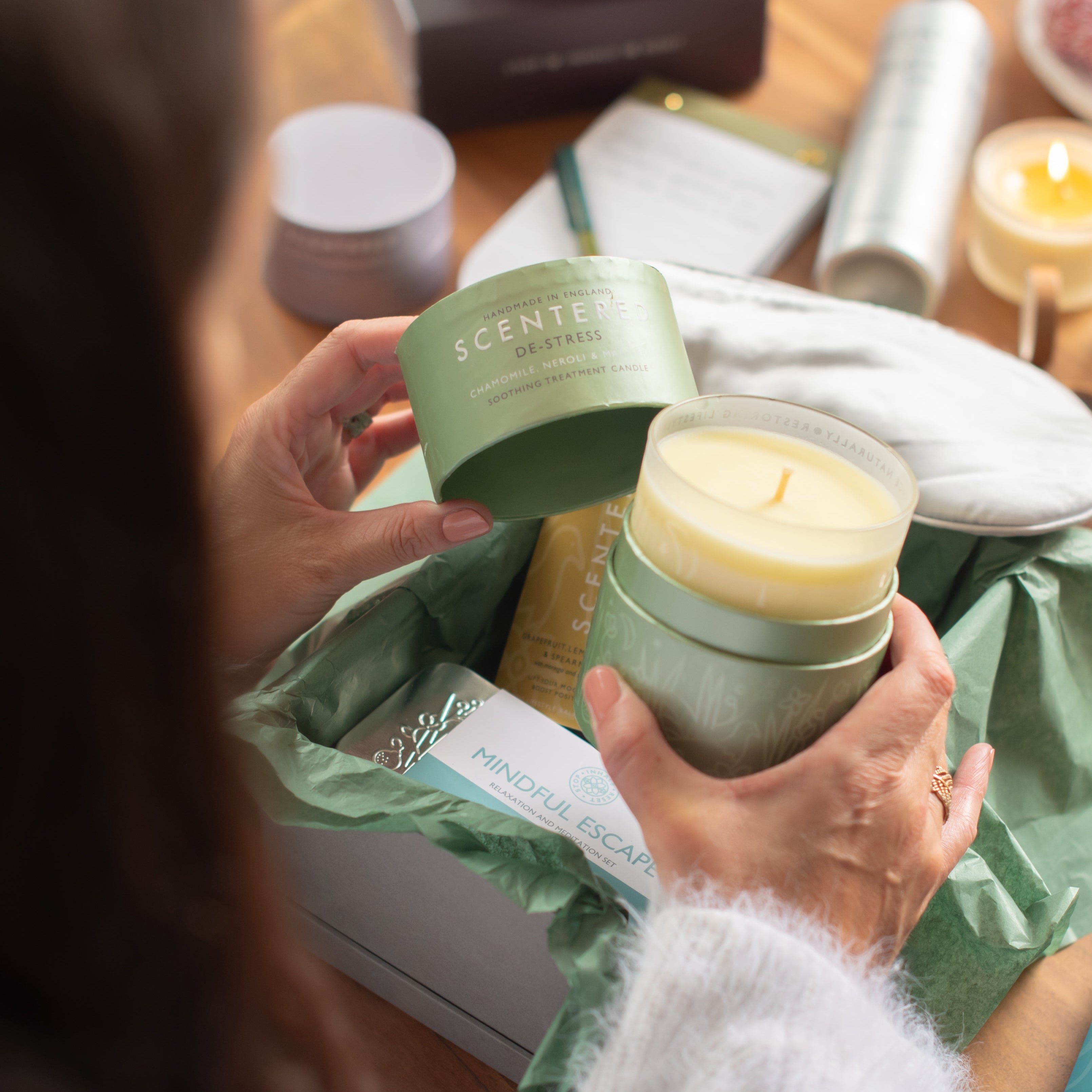 De-stress candle be touch in hand from the Christmas gift box.