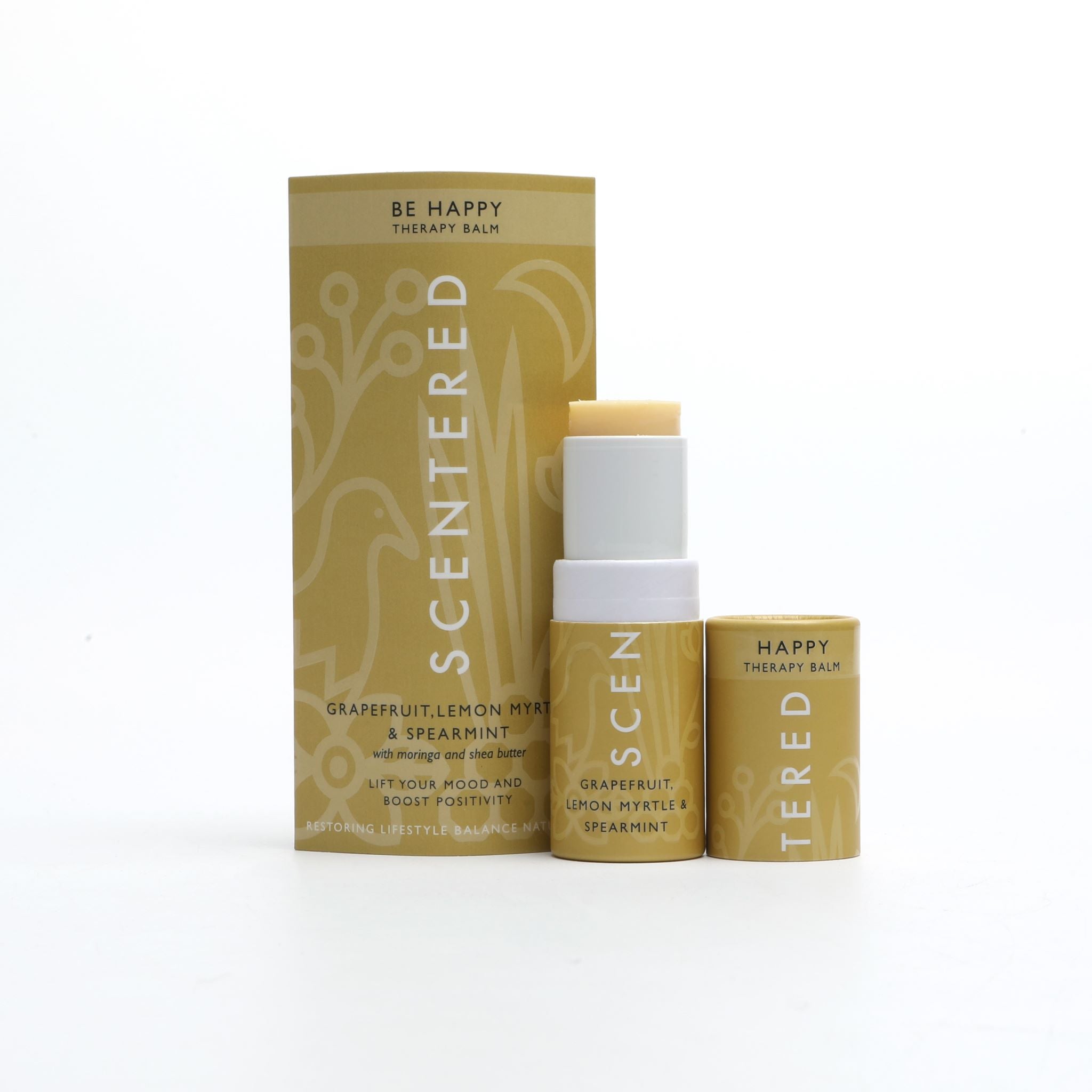 Happy Aromatherapy Balm with cap off and twisted up with eco sleeve packaging on a white background