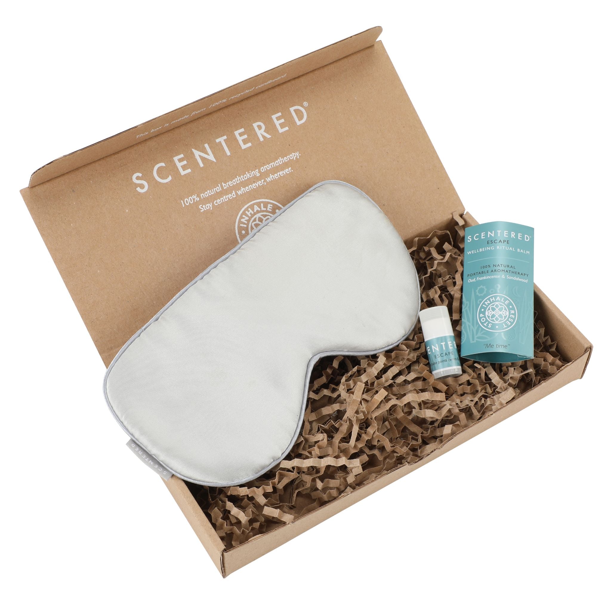 An eyemask and an escape balm in the opening box.
