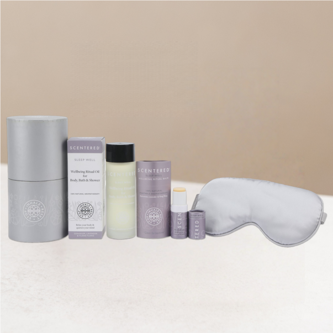 Set of sleep wellness products including a sleep mask, sleep balm, and a box sleep balm sleeve, sleep well body oil and box.