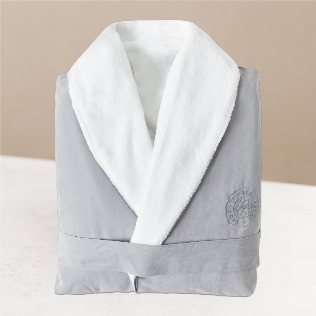 Gray robe with white collar on a warming background