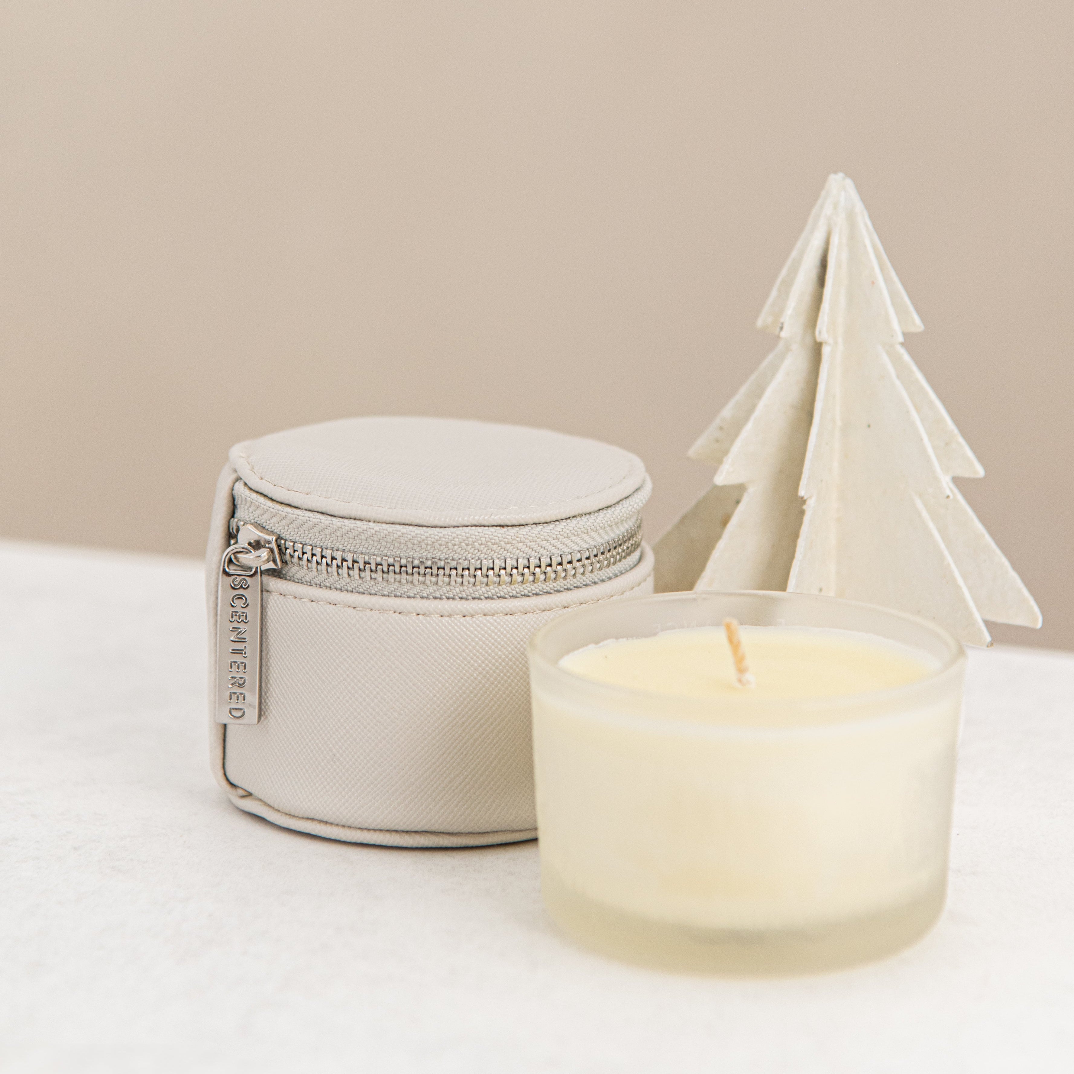 Travel candle and pouch with the Christmas decoration.