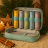 Set of Scentered balm set in a carrying case with Christmas decorations in the background
