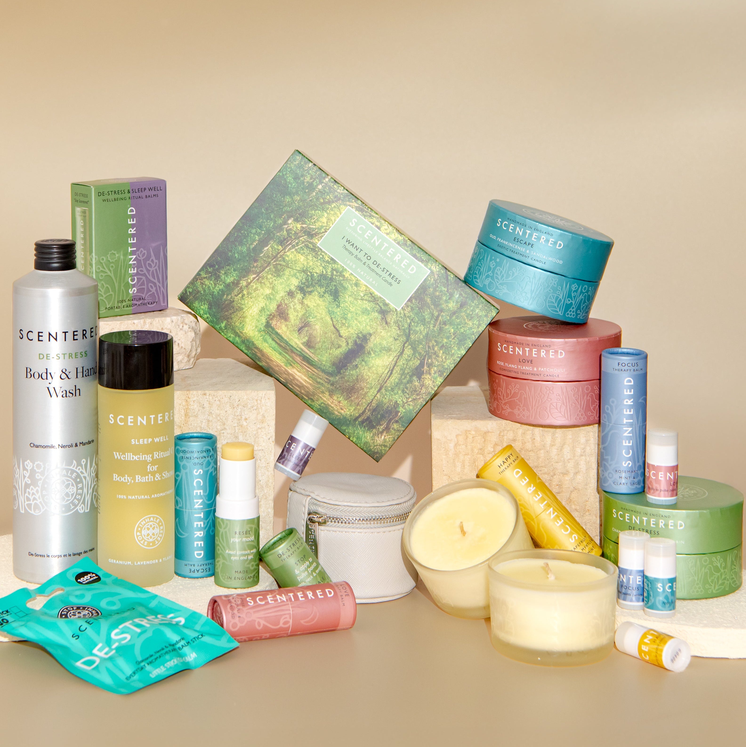 Wellbeing booster box including de-stress hand wash, body oil, escape balm, de-stress balm. focus balm, love balm and candles.