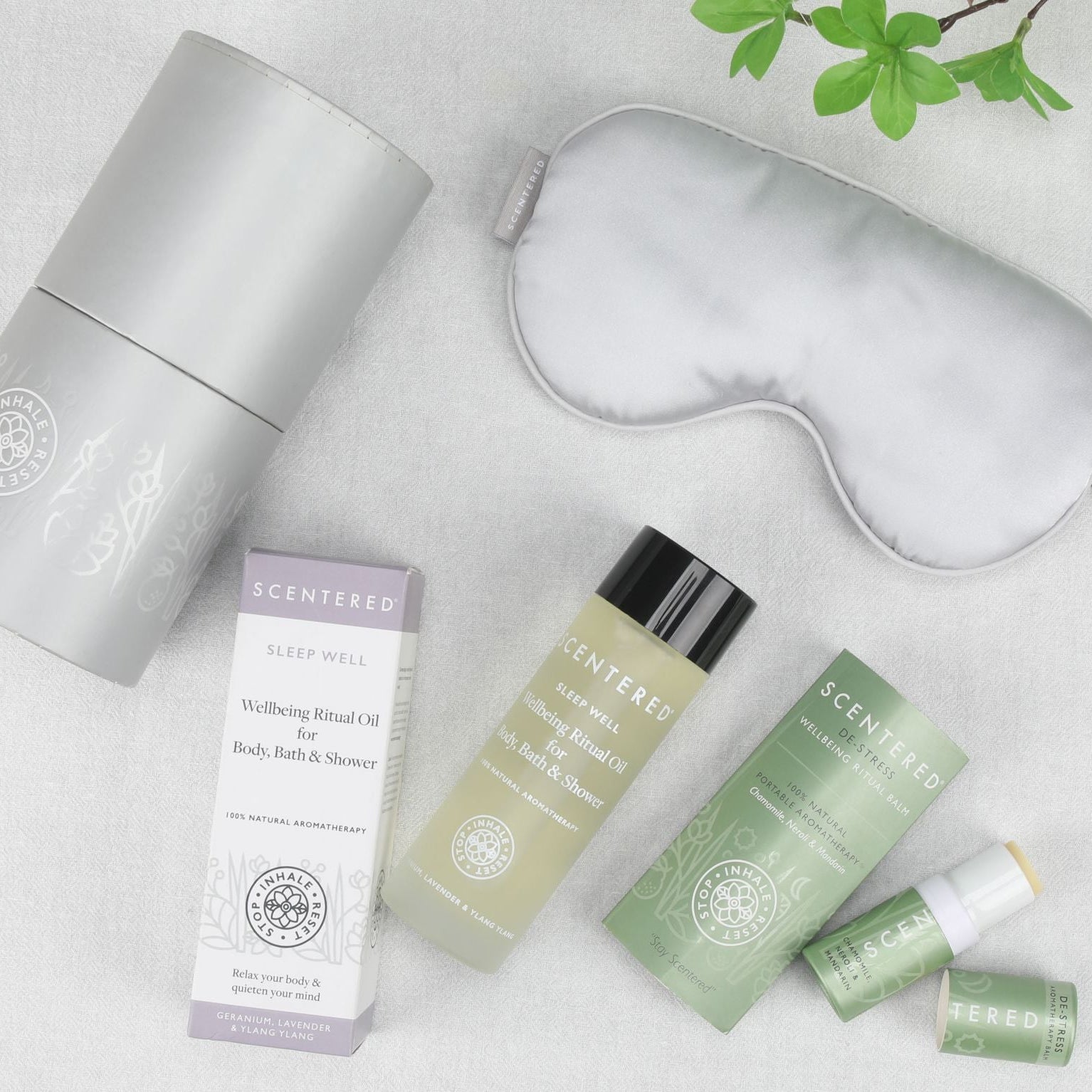 Flat lay image of Scentered  Sleep Well body oil, De-stress Aromatherapy balm and silk eye mask