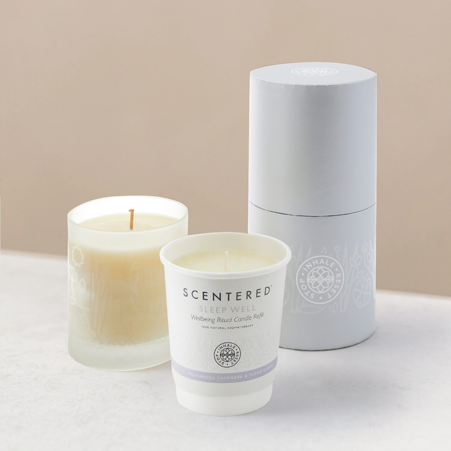 Scented sleep well candles and packaging on display.