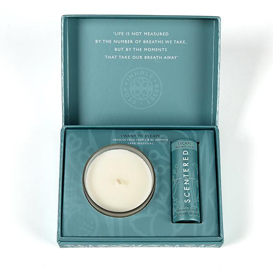 Scentered Escape balm gift set featuring a candle and therapy balm in teal packaging with the inspirational quote ‘Life is not measured by the number of breaths we take, but by the moments that take our breath away.