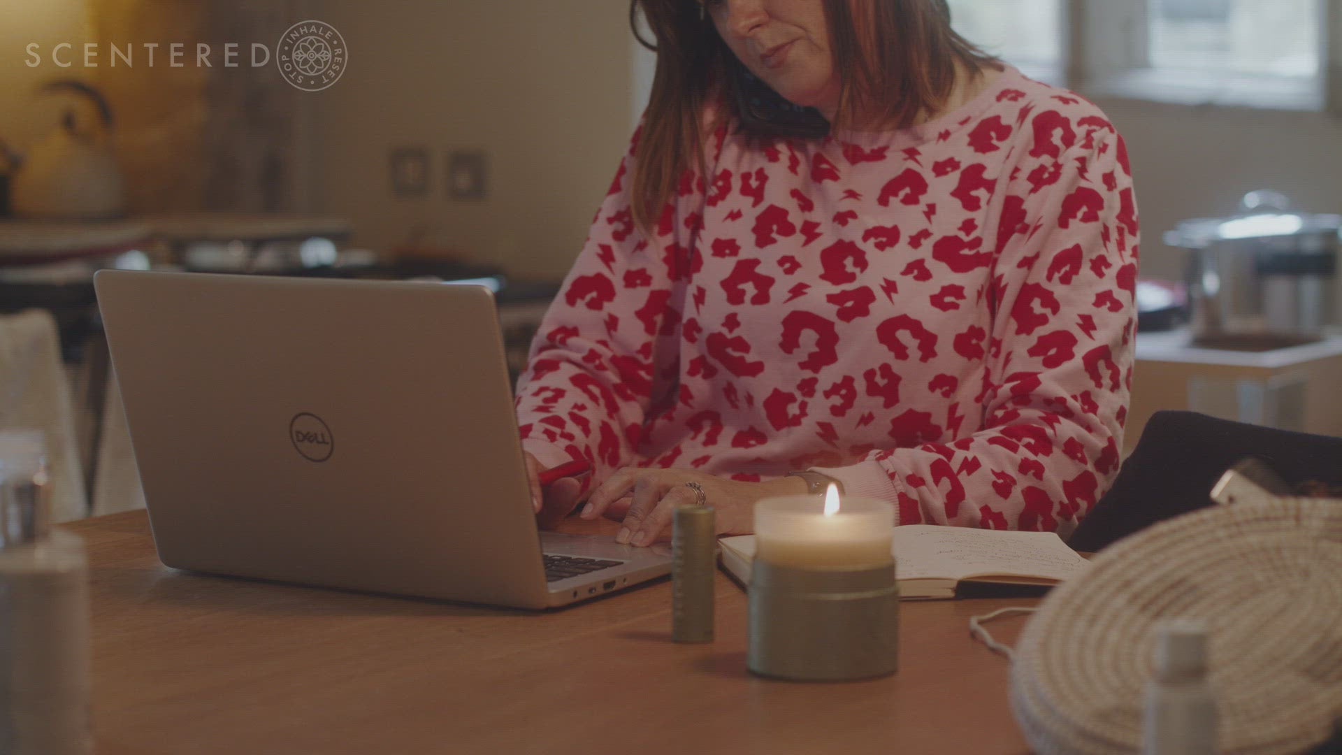 apply the Scentered De-Stress Calm Aromatherapy Balm, she stops inhales the essential oils of Mandarin, Neroli and Camomile and resets and calmly places the balm down next to the glowing candle, paper and pen.  