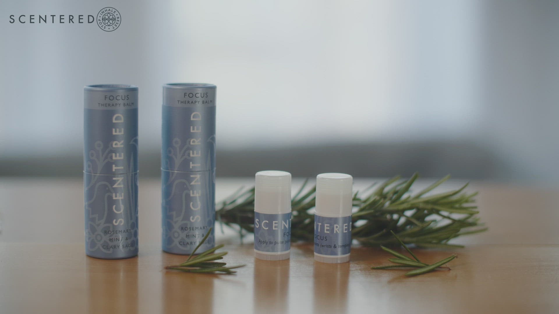 Scentered focus balms in shot, the transition to a woman pulling the focus balm out of her handbag. Rubbing her pulse points with the balm and walking down the road 